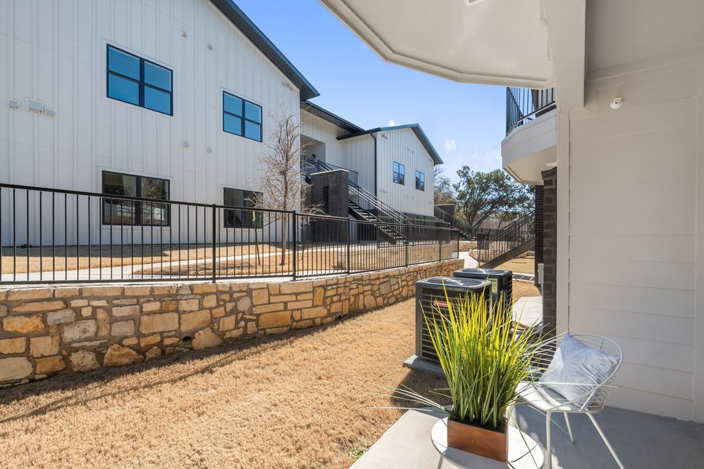 2450 Wickersham Lane, Unit 1927 Austin, TX 78741 - Photo 21 of 40 a view of a house with backyard and sitting area