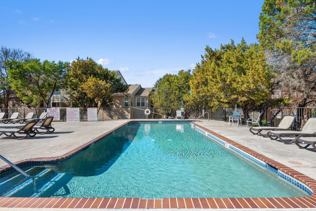 2450 Wickersham Lane, Unit 1927 Austin, TX 78741 - Photo 31 of 40 a view of backyard with swimming pool and seating space