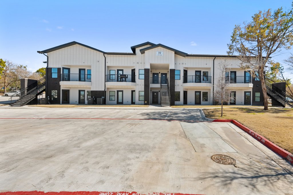 2450 Wickersham Lane, Unit 1927 Austin, TX 78741 - Photo 34 of 40 a view of multiple houses with a street