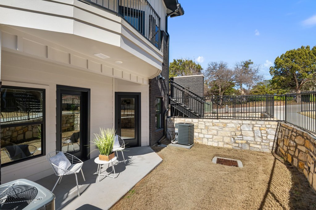 2450 Wickersham Lane, Unit 1927 Austin, TX 78741 - Photo 39 of 40 a view of a patio with couches table and chairs