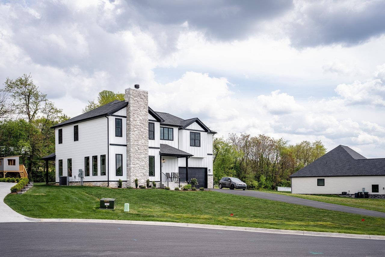 130 Millview Drive Bridgewater, VA 22812 - Photo 11 of 74 a view of a white house with a big yard and large trees