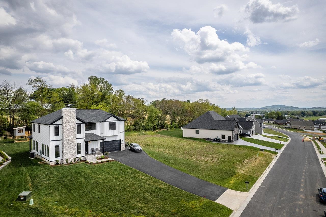 130 Millview Drive Bridgewater, VA 22812 - Photo 3 of 74 a view of a house with a big yard and large trees