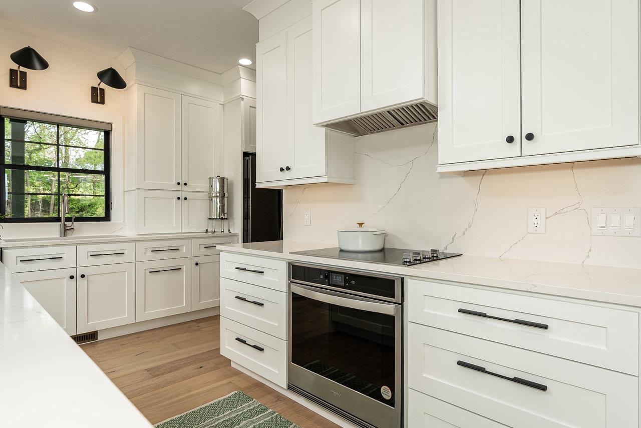 130 Millview Drive Bridgewater, VA 22812 - Photo 36 of 74 a kitchen with granite countertop white cabinets and white appliances