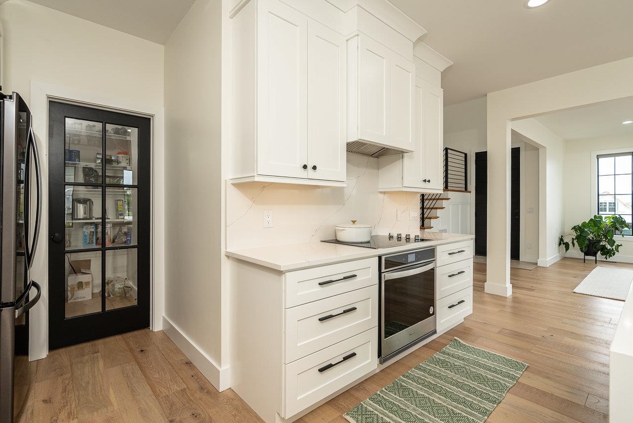 130 Millview Drive Bridgewater, VA 22812 - Photo 44 of 74 a kitchen with stainless steel appliances a stove top oven and a refrigerator