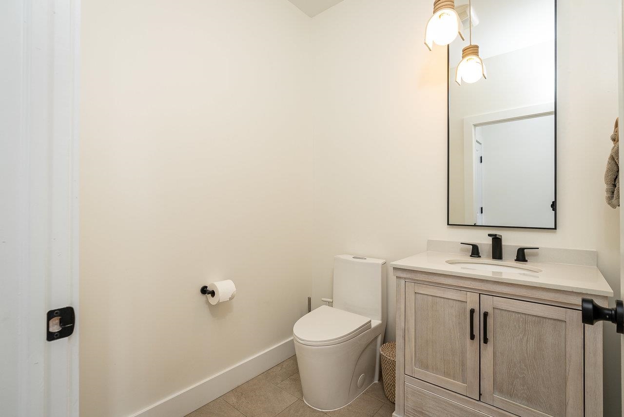 130 Millview Drive Bridgewater, VA 22812 - Photo 53 of 74 a bathroom with a toilet sink vanity and mirror