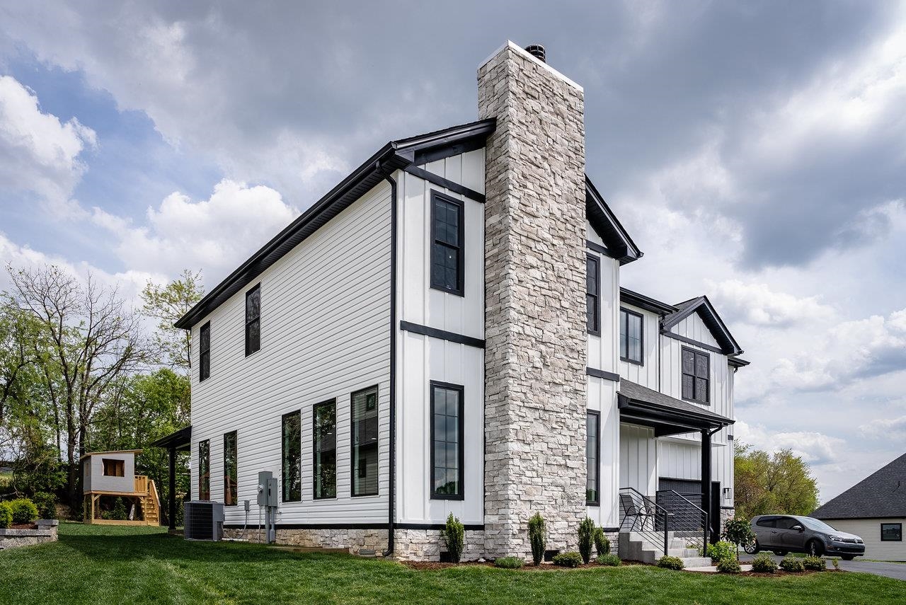 130 Millview Drive Bridgewater, VA 22812 - Photo 10 of 74 a view of a brick building next to a yard