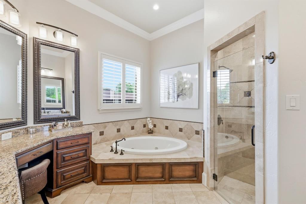 476 Hidden Valley Lane Coppell, TX 75019 - Photo 15 of 40 a bathroom with a bathtub and a sink