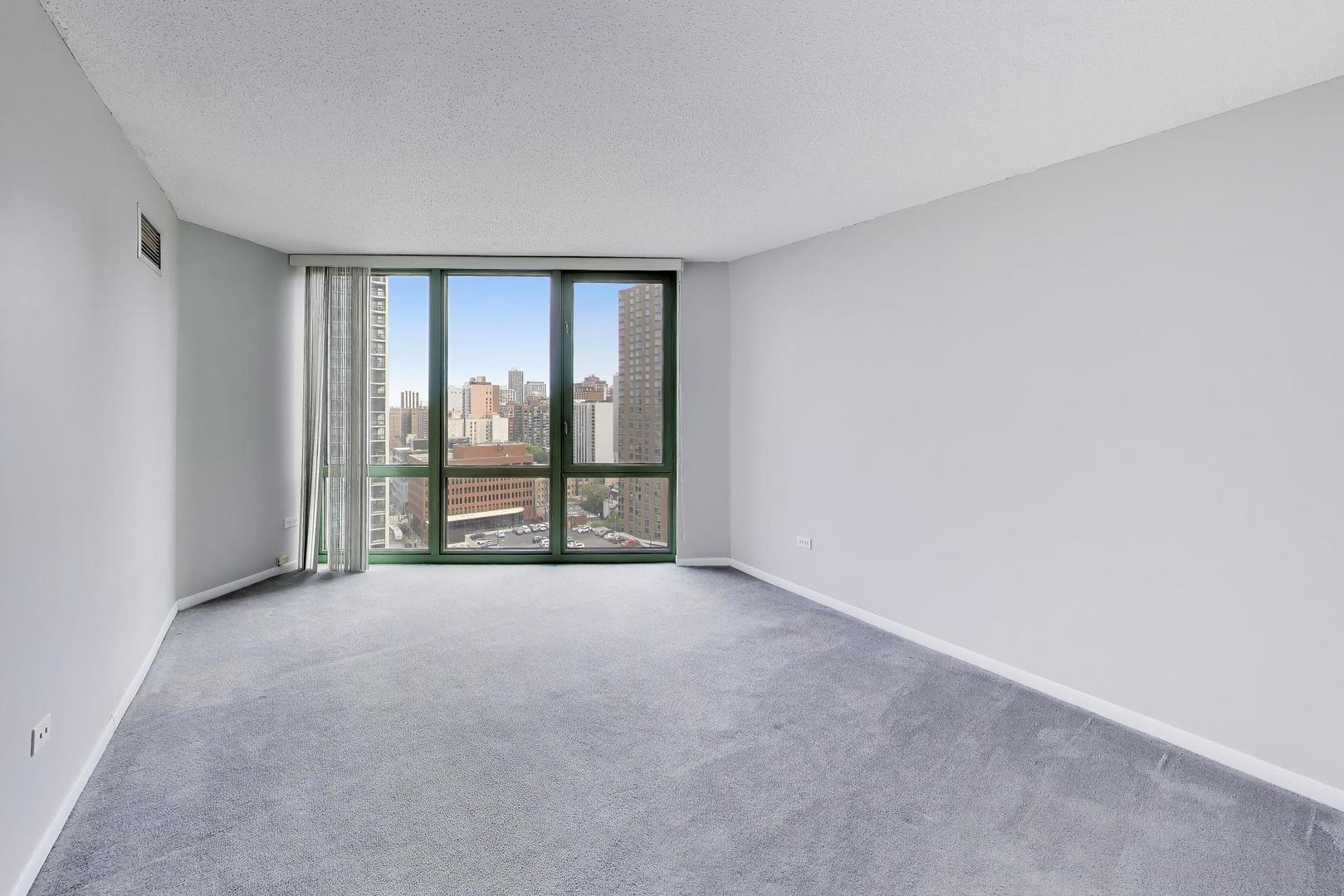 111 West Maple Street, Unit 1503 Chicago, IL 60610 - Photo 24 of 39 a view of an empty room with windows