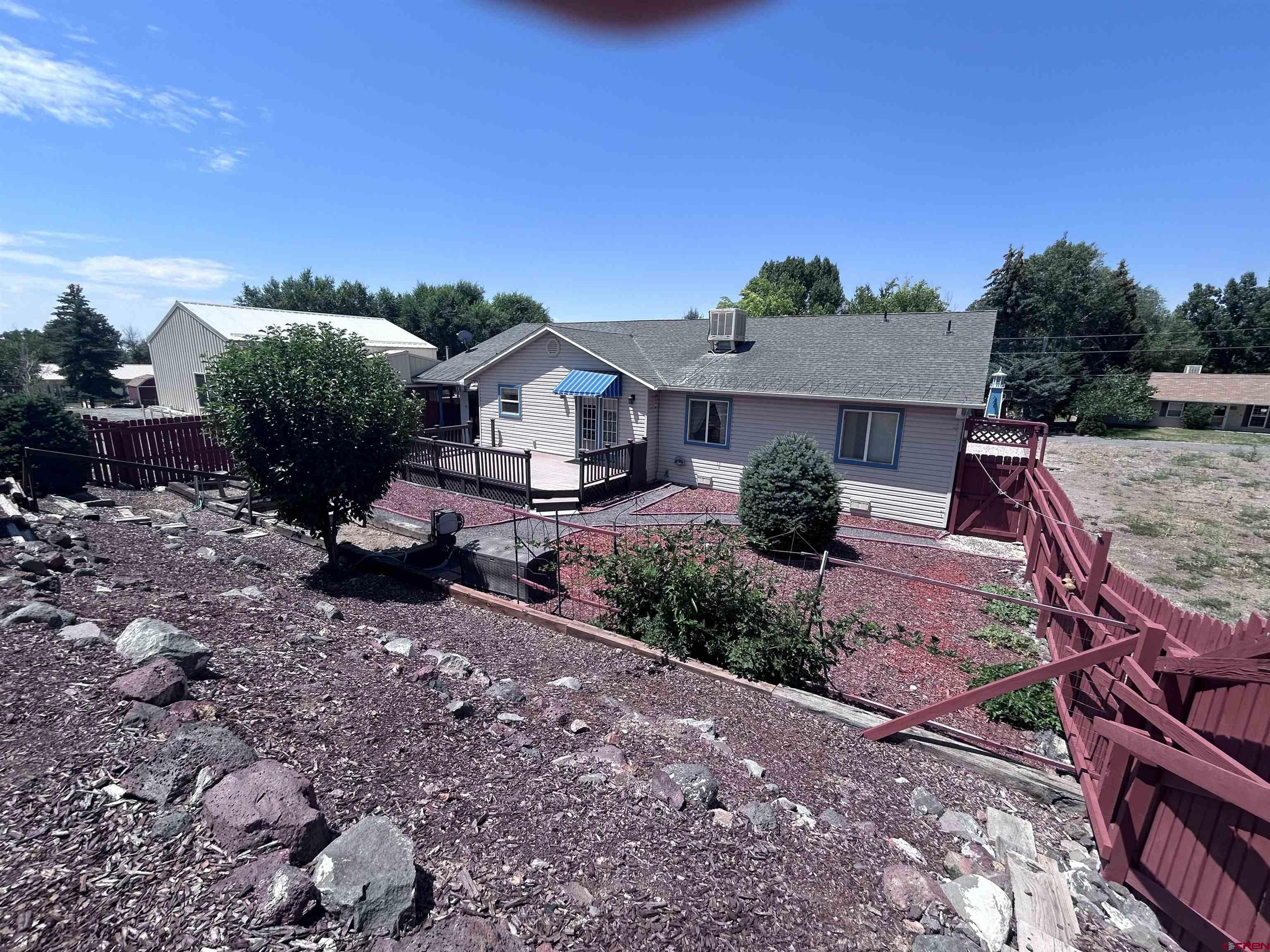 185-165 Northwest 11th Street Cedaredge, CO 81413 - Photo 11 of 34 a view of a house with a yard