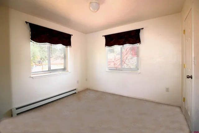 an empty room with a large window
