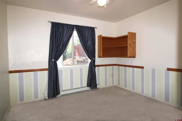 a view of entryway with a small yard