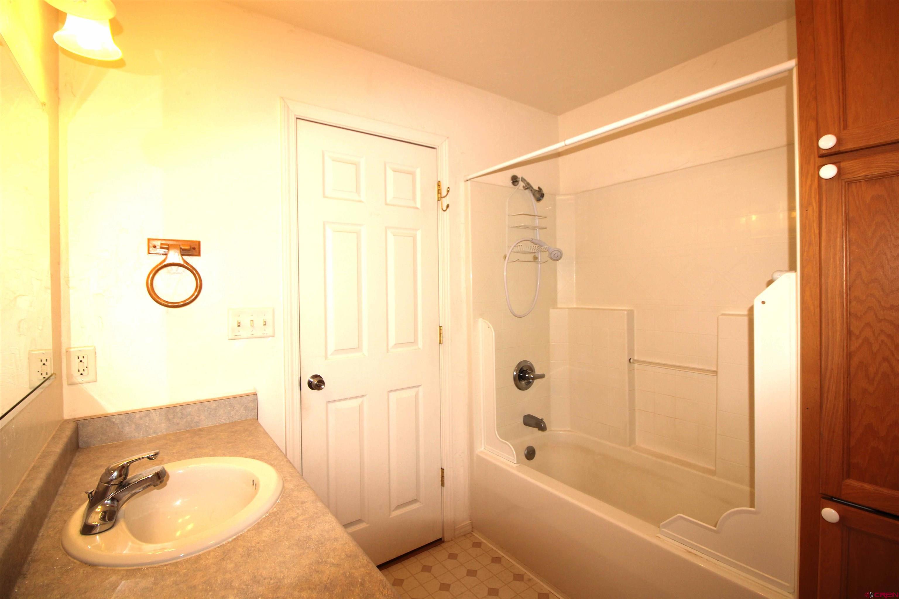 185-165 Northwest 11th Street Cedaredge, CO 81413 - Photo 20 of 34 a bathroom with a sink and a shower