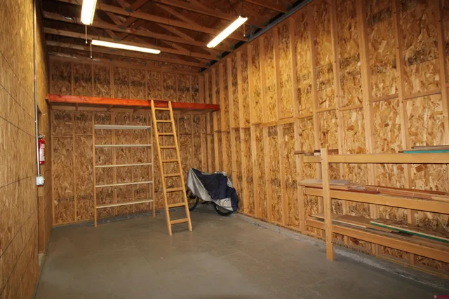 a view of an empty room with a brick wall