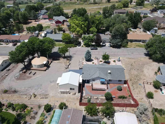 an aerial view of a houses with outdoor space