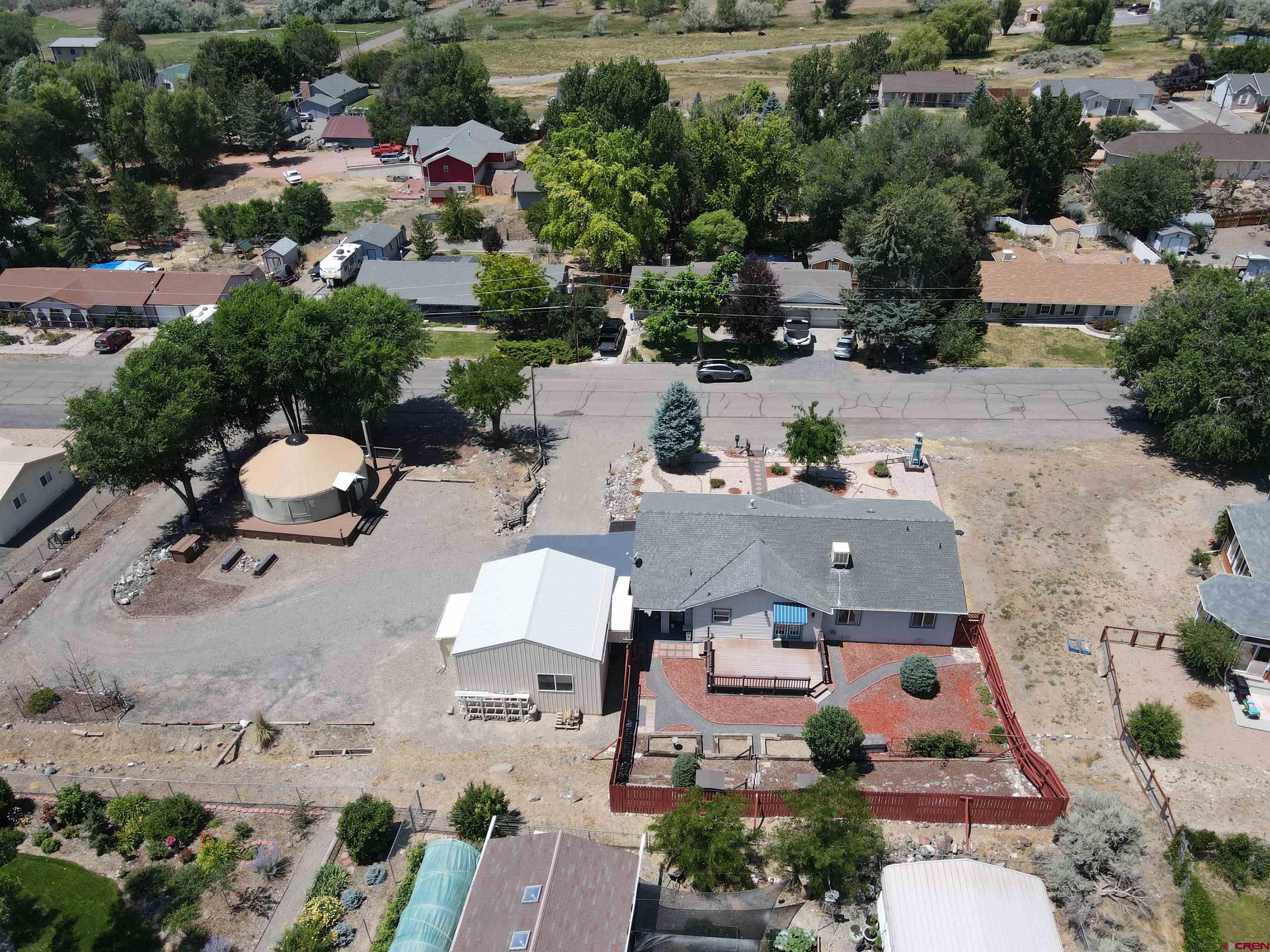 185-165 Northwest 11th Street Cedaredge, CO 81413 - Photo 33 of 34 an aerial view of a houses with outdoor space