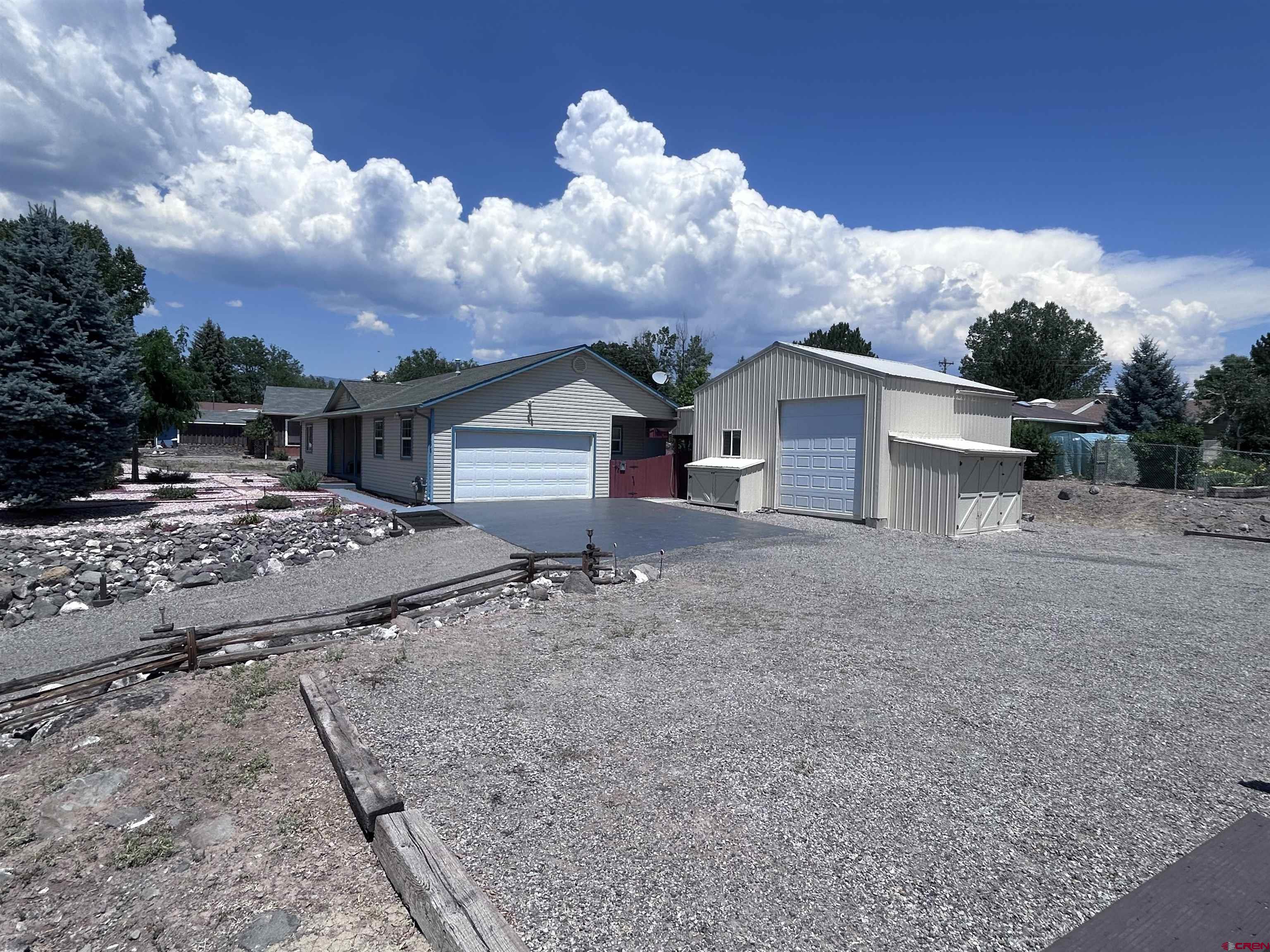 185-165 Northwest 11th Street Cedaredge, CO 81413 - Photo 6 of 34 a view of a house with backyard and trees