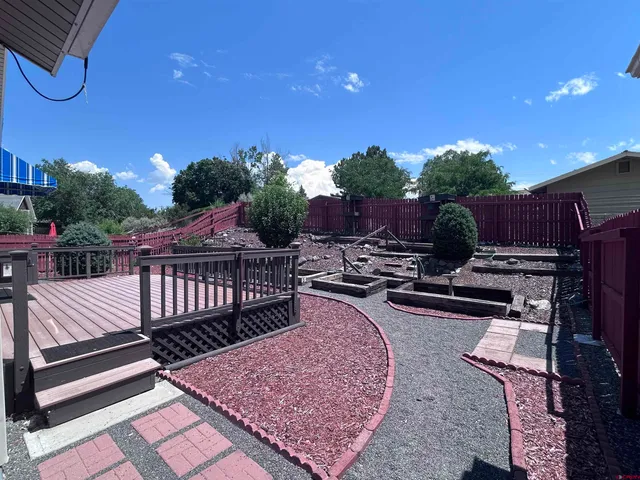 a view of balcony with wooden floor and outdoor seating