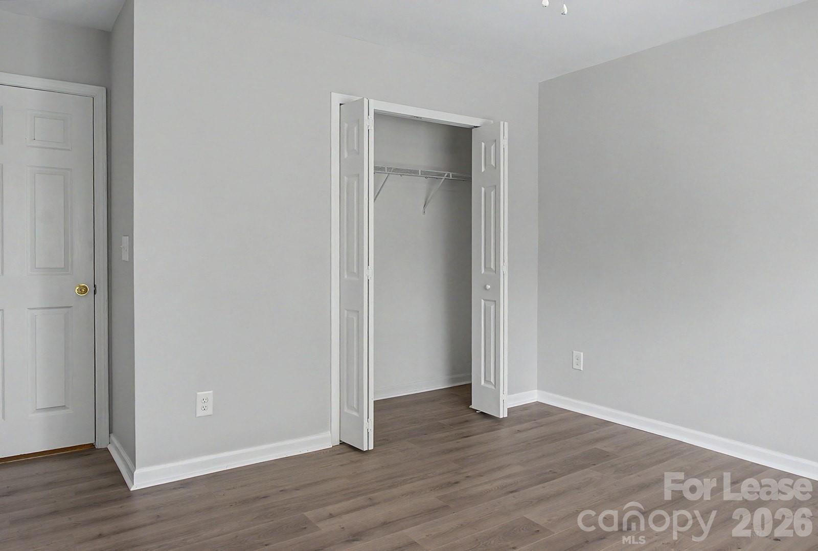 2917 Liddington Road Matthews, NC 28105 - Photo 21 of 44 a view of an empty room with wooden floor