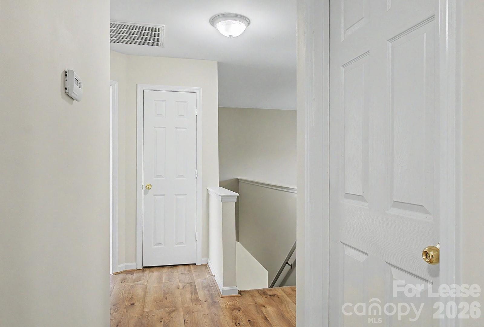 2917 Liddington Road Matthews, NC 28105 - Photo 26 of 44 a view of hallway with wooden floor