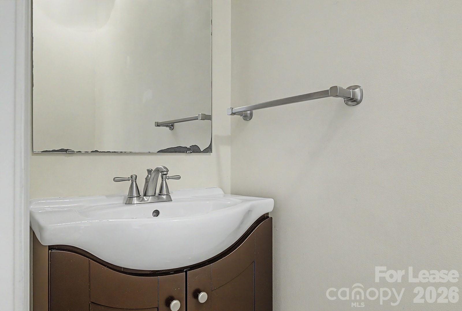 2917 Liddington Road Matthews, NC 28105 - Photo 29 of 44 a bathroom with a sink and a mirror