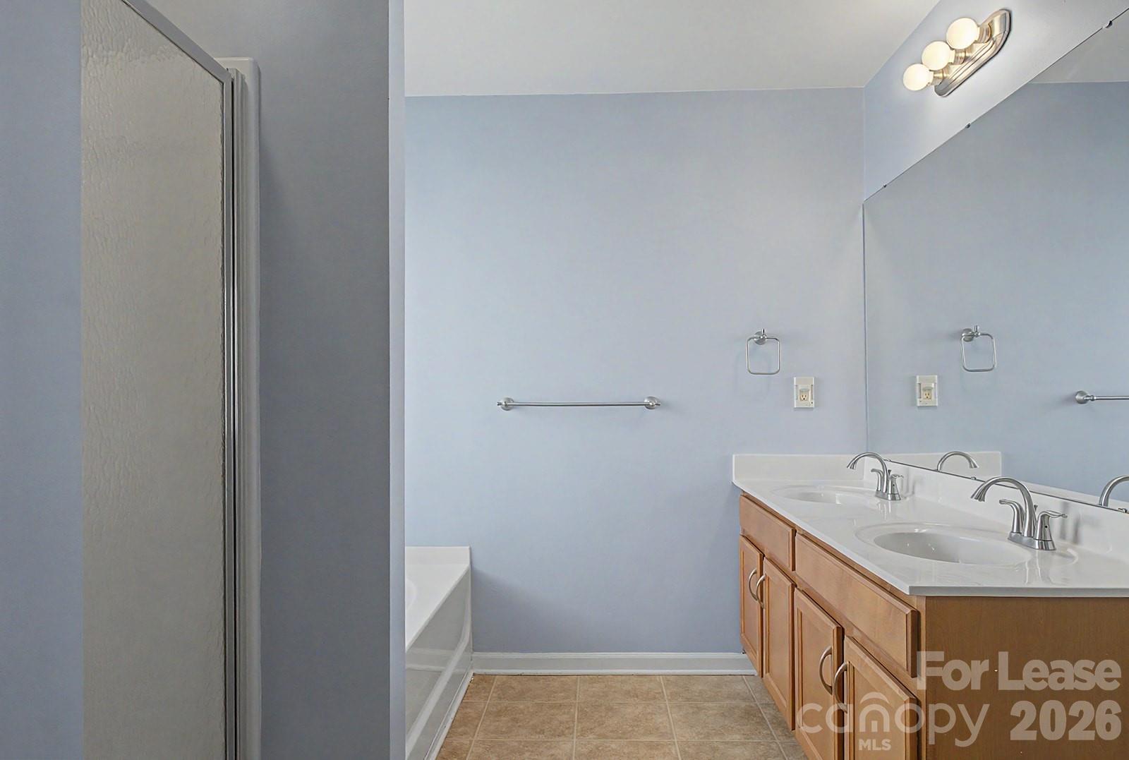 2917 Liddington Road Matthews, NC 28105 - Photo 33 of 44 a bathroom with a sink and a mirror