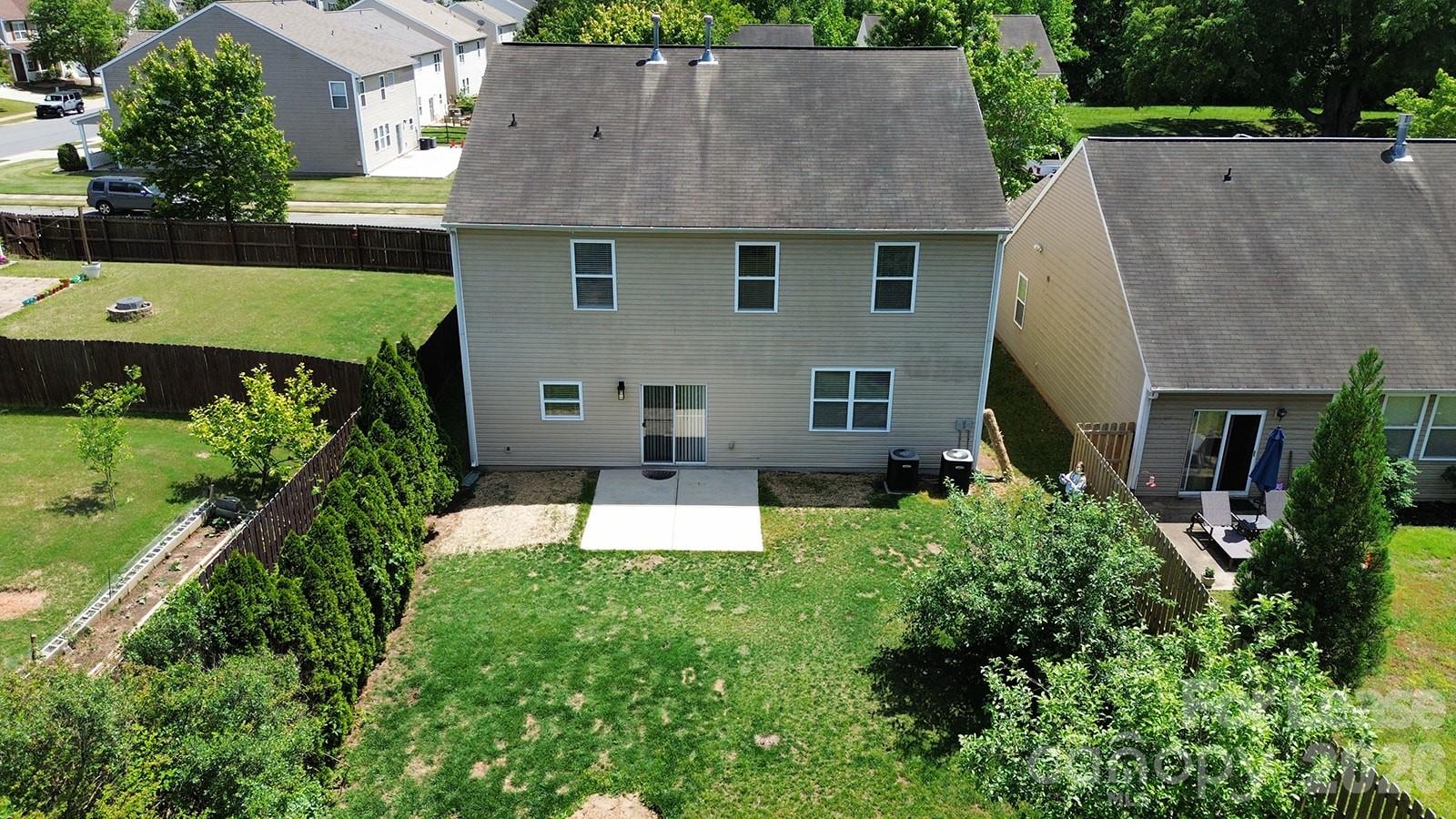 2917 Liddington Road Matthews, NC 28105 - Photo 43 of 44 an aerial view of a house with a garden and trees