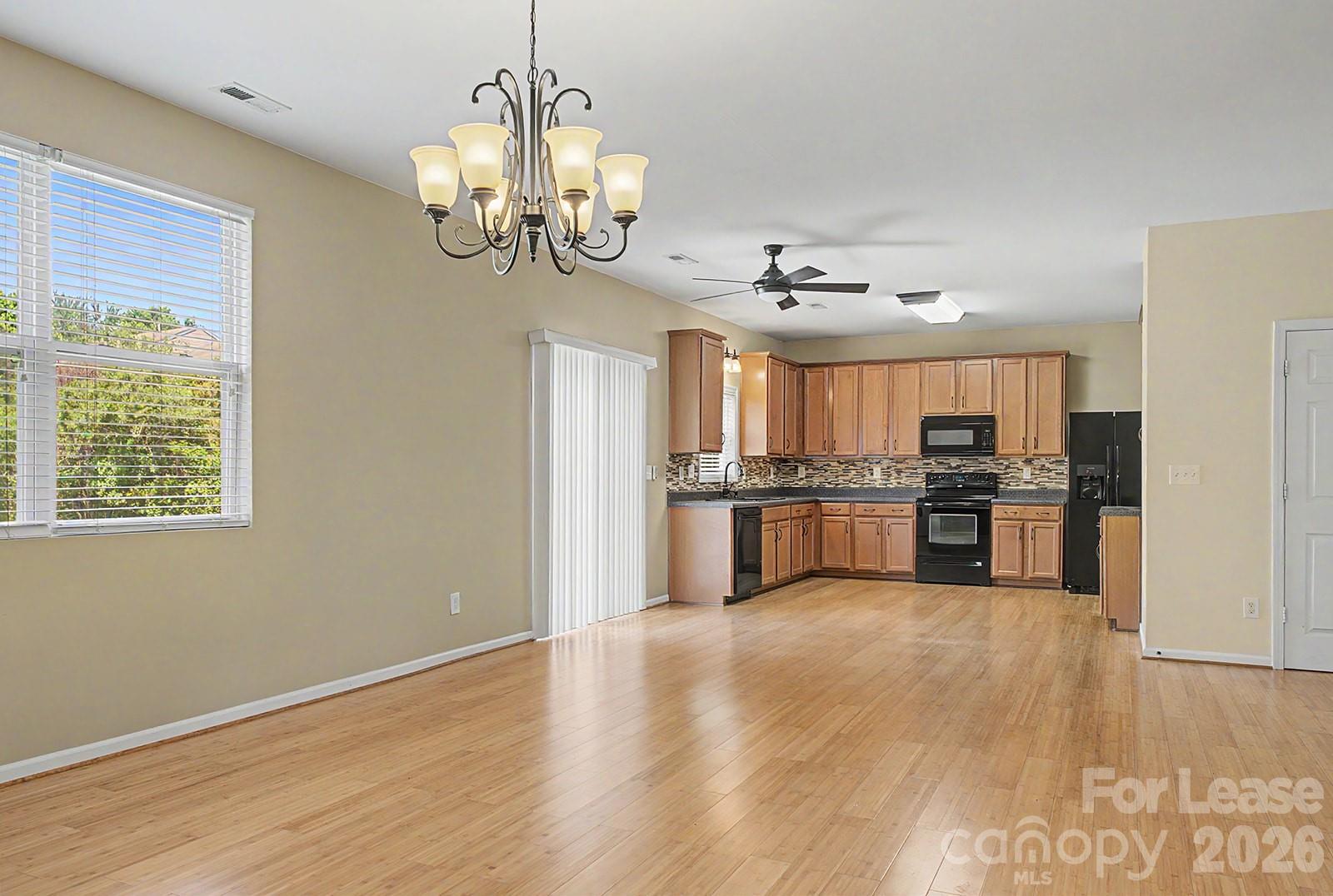 2917 Liddington Road Matthews, NC 28105 - Photo 9 of 44 a view of a kitchen with stove and cabinets
