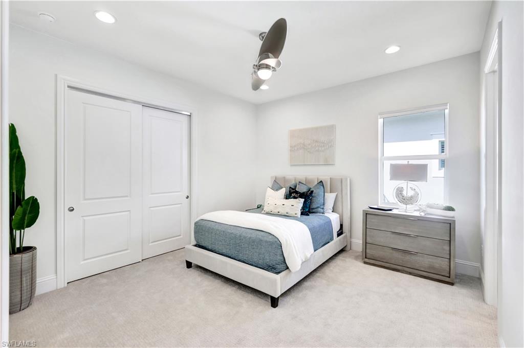 8912 Nevis Way Naples, FL 34112 - Photo 19 of 45 Carpeted bedroom with ceiling fan, recessed lighting, and a closet
