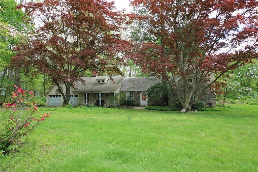 338 Westport Road Wilton, CT 06897 - Photo 1 of 1 a front view of a house with garden