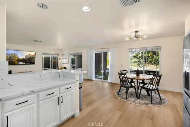 a view of a dining room with furniture and window