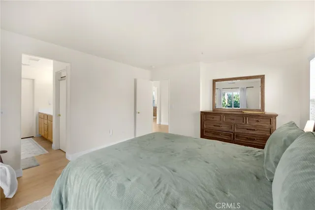 a bedroom with a bed and a television in it