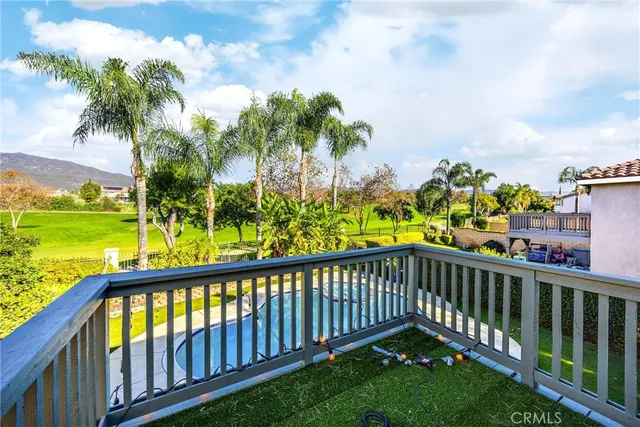 a view of a chairs and table on the wooden deck