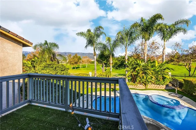 a view of a swimming pool with a yard