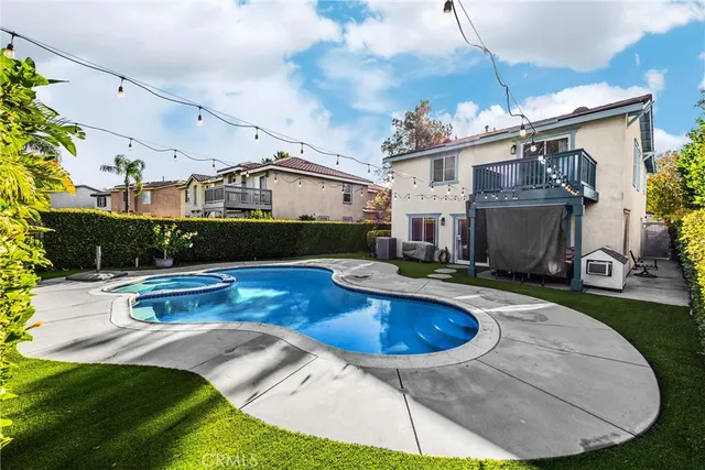 a view of a swimming pool with a yard