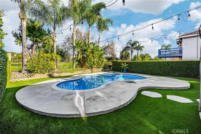a view of a swimming pool in a yard