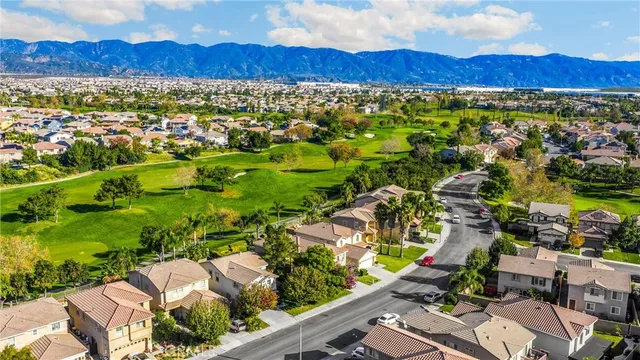 a view of a city with mountains in the background
