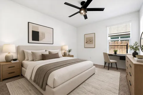 a bedroom with bed and a window