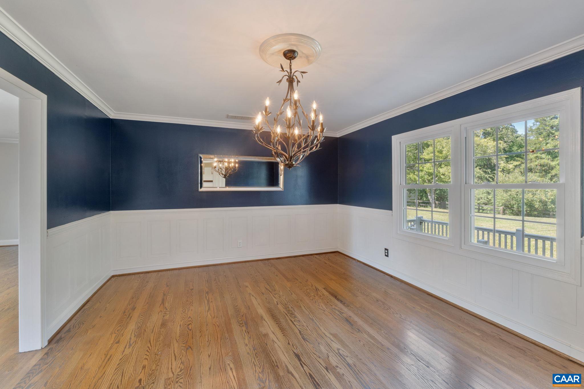 2160 Devonshire Road Charlottesville, VA 22901 - Photo 12 of 43 a view of a hallway with wooden floor and chandelier