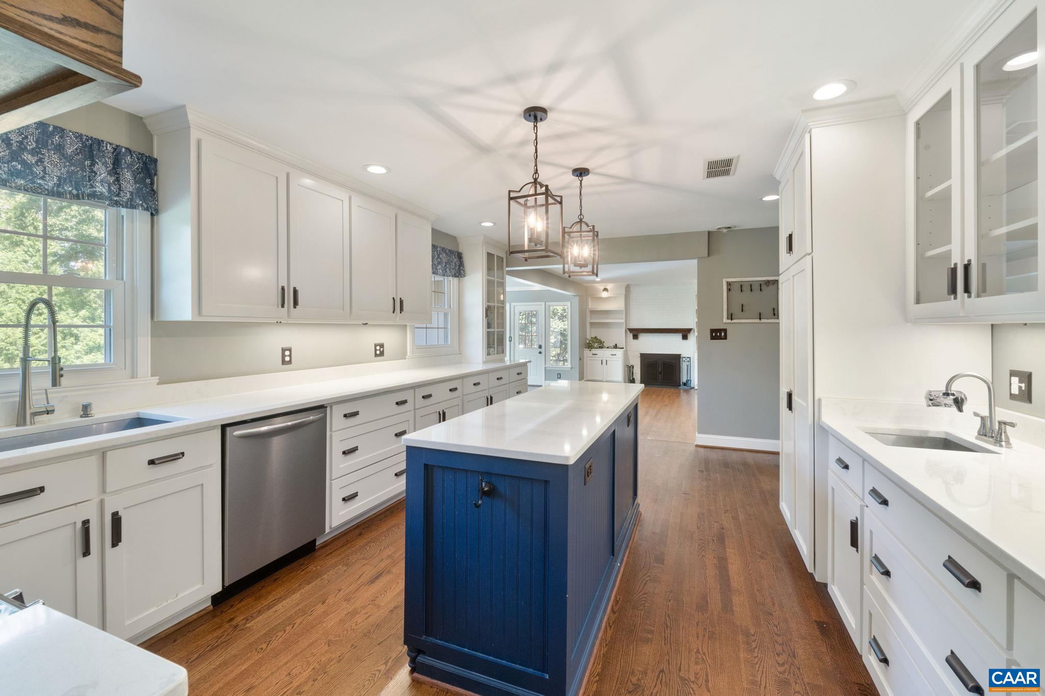 2160 Devonshire Road Charlottesville, VA 22901 - Photo 14 of 43 a large kitchen with kitchen island granite countertop lots of counter space and wooden floor