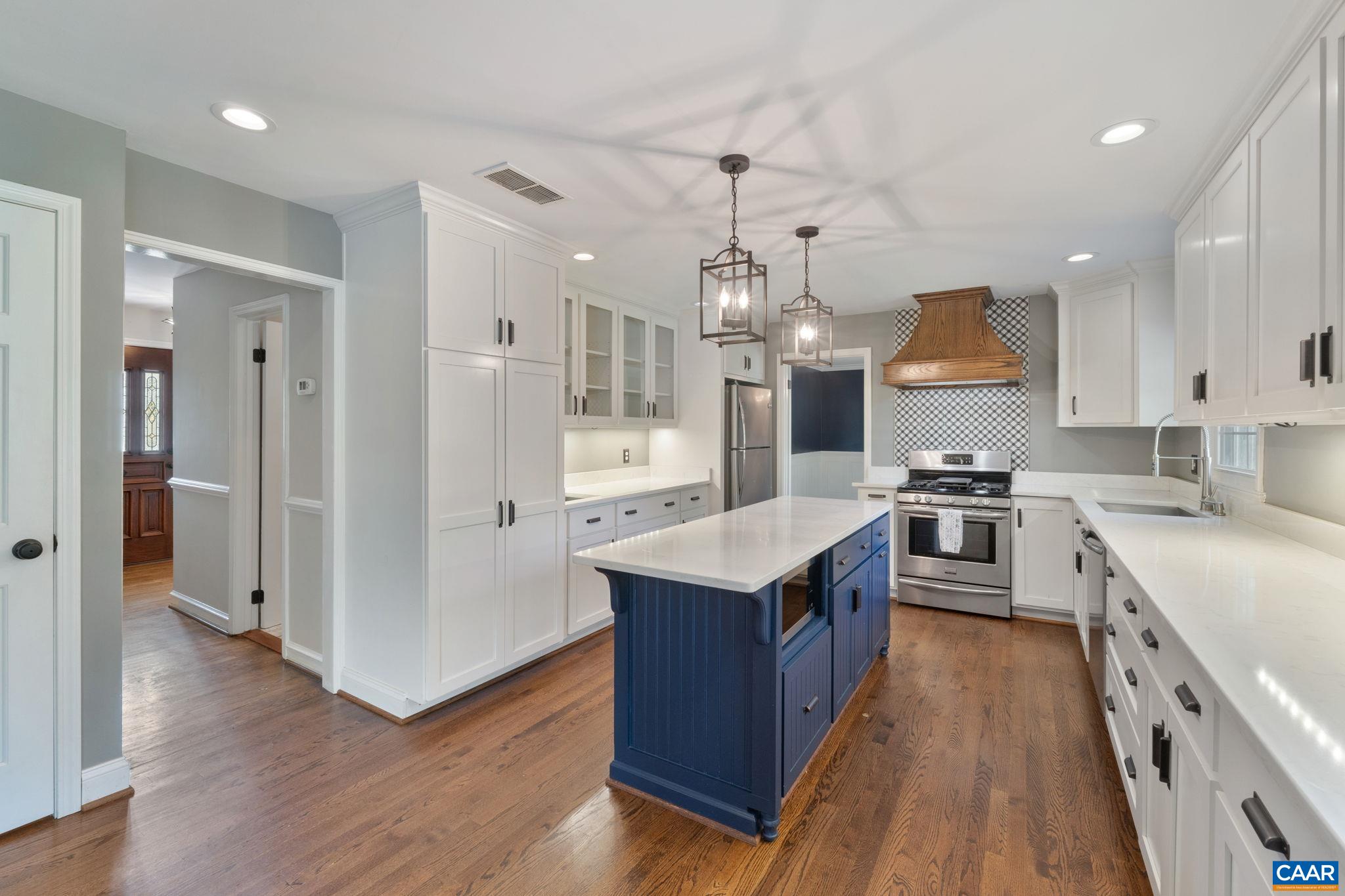 2160 Devonshire Road Charlottesville, VA 22901 - Photo 17 of 43 a kitchen with stainless steel appliances granite countertop wooden floors and sink