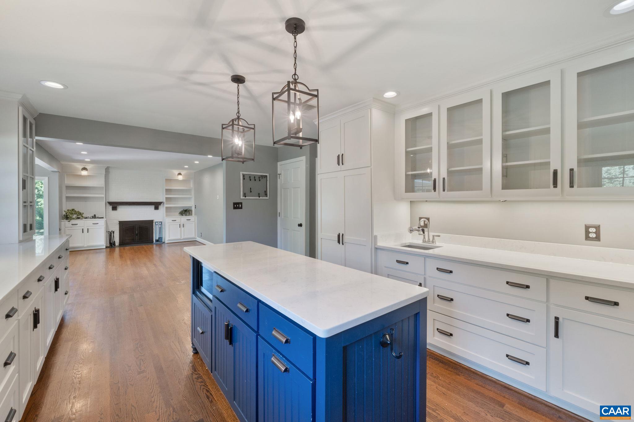2160 Devonshire Road Charlottesville, VA 22901 - Photo 18 of 43 a large kitchen with kitchen island a sink a center island stainless steel appliances and cabinets