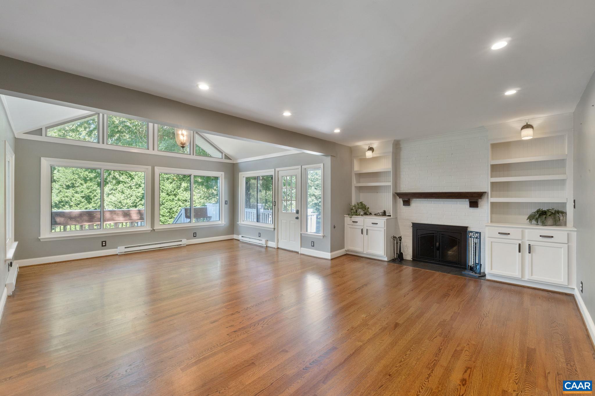 2160 Devonshire Road Charlottesville, VA 22901 - Photo 20 of 43 a view of an empty room with a fireplace and a floor to ceiling window