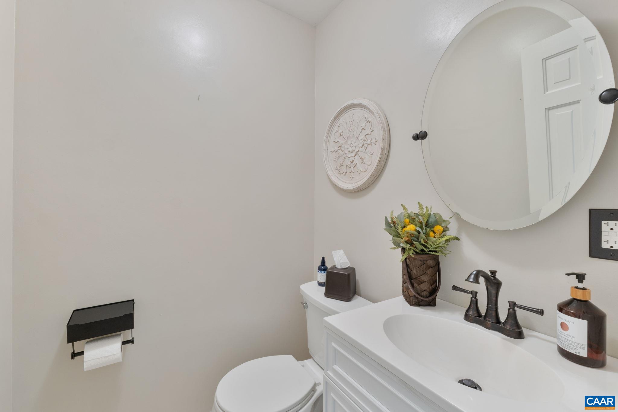 2160 Devonshire Road Charlottesville, VA 22901 - Photo 23 of 43 a bathroom with a toilet sink and mirror