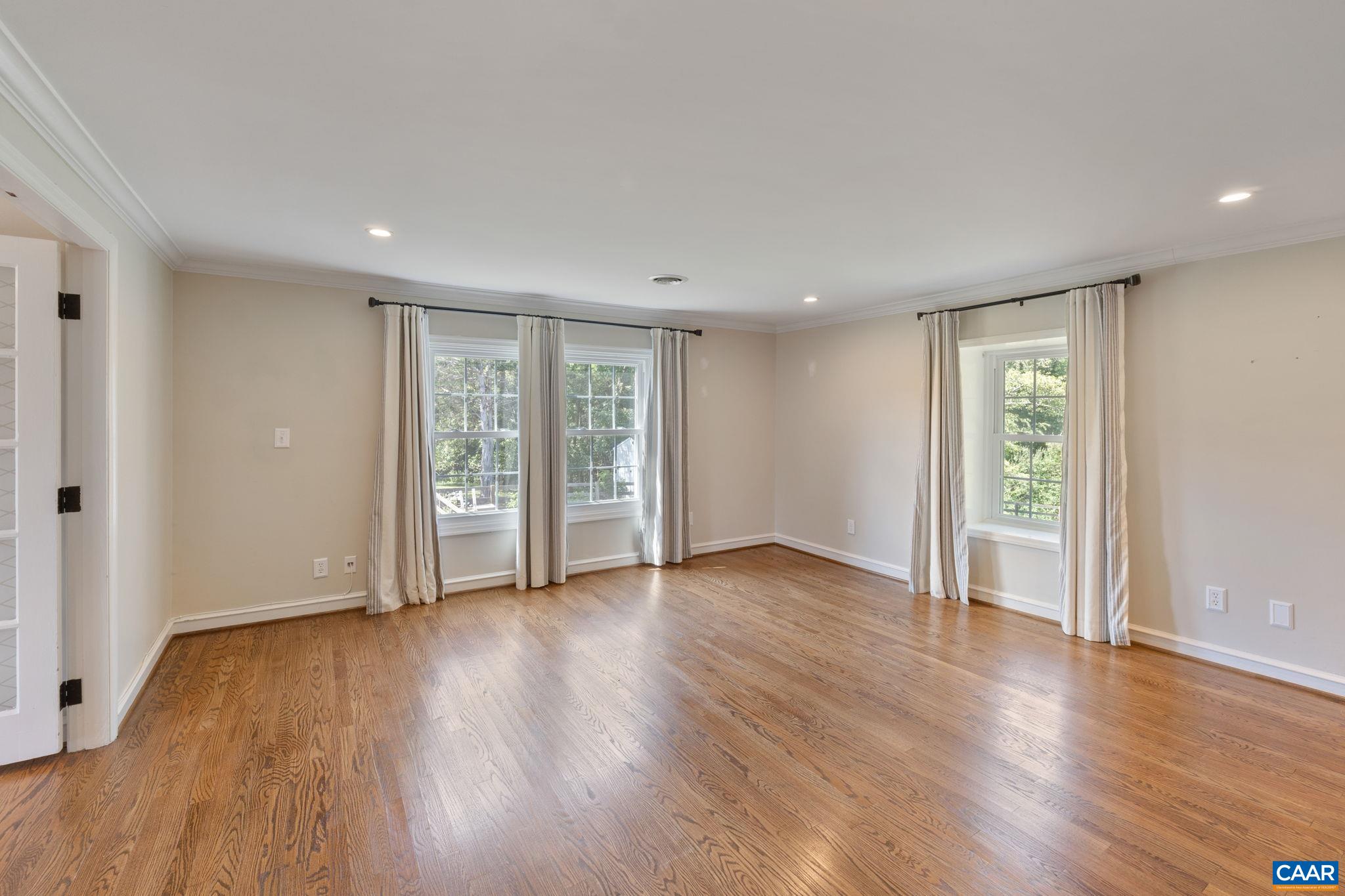 2160 Devonshire Road Charlottesville, VA 22901 - Photo 24 of 43 a view of an empty room with wooden floor and a window