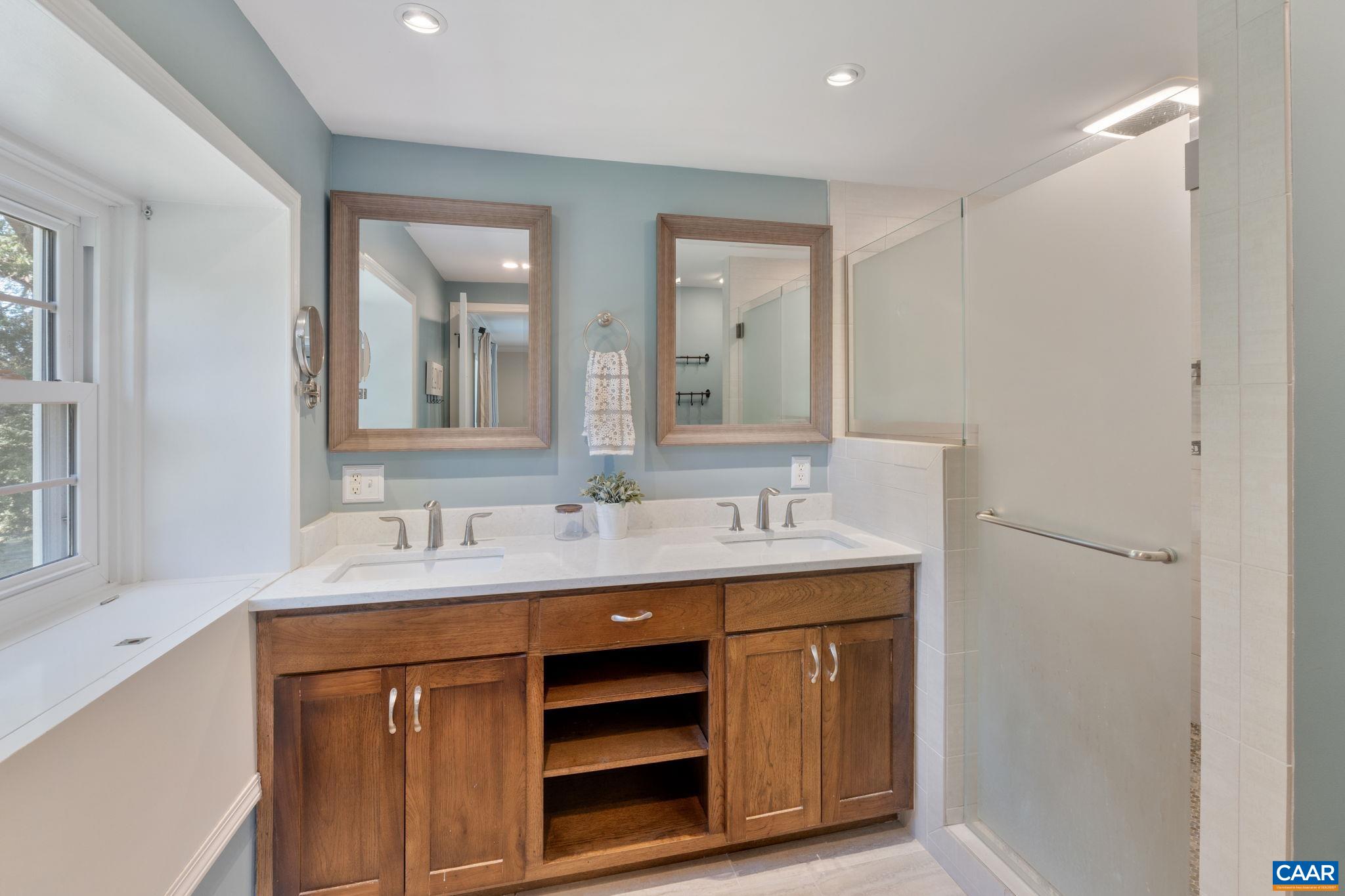 2160 Devonshire Road Charlottesville, VA 22901 - Photo 28 of 43 a bathroom with a double vanity sink and mirror