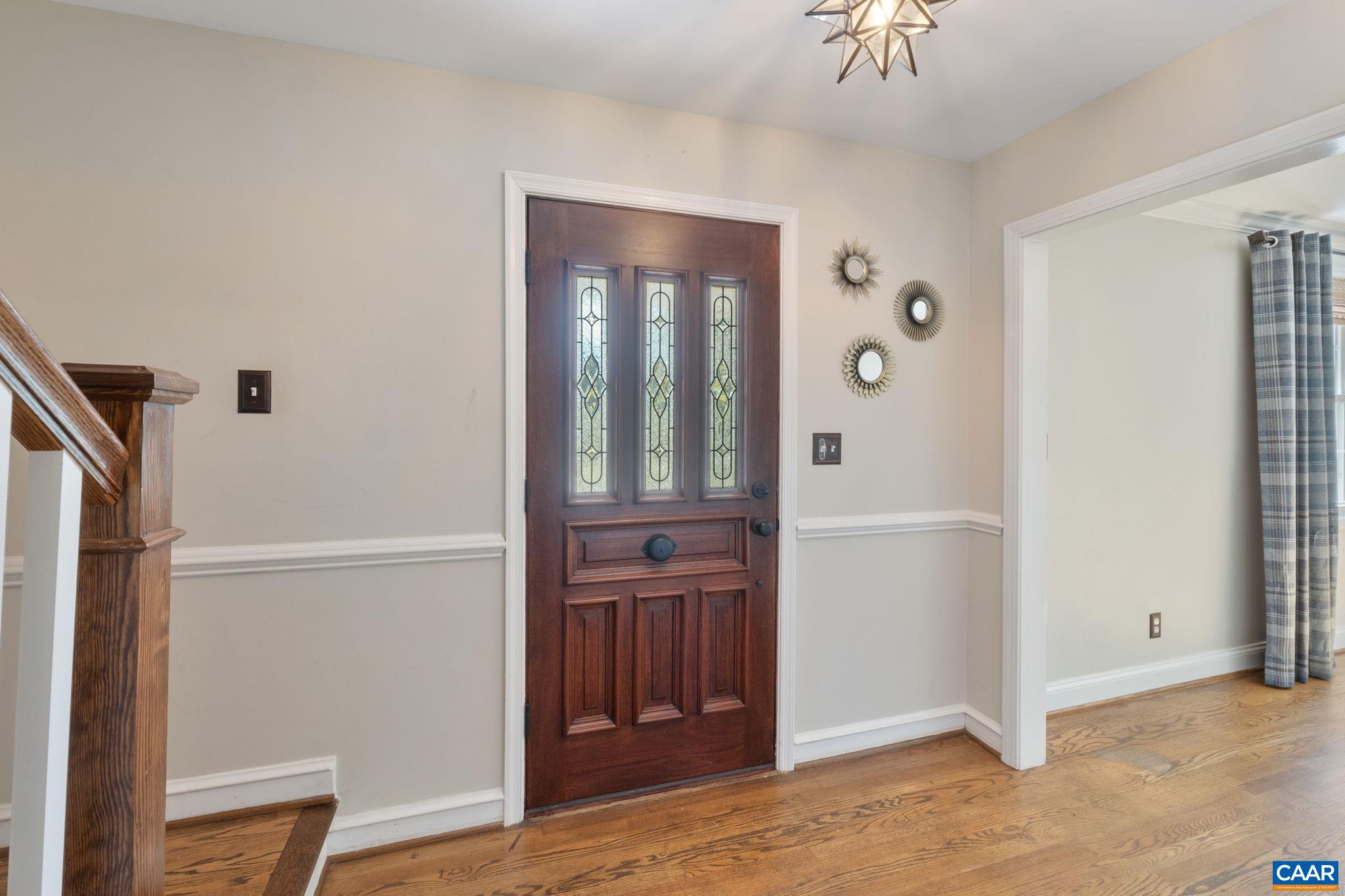 2160 Devonshire Road Charlottesville, VA 22901 - Photo 8 of 43 a view of a hallway with wooden floor and cabinet
