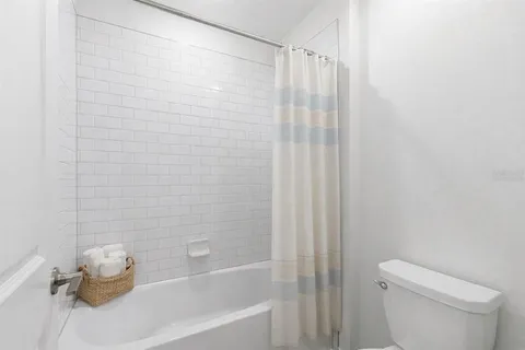 a bathroom with a shower curtain
