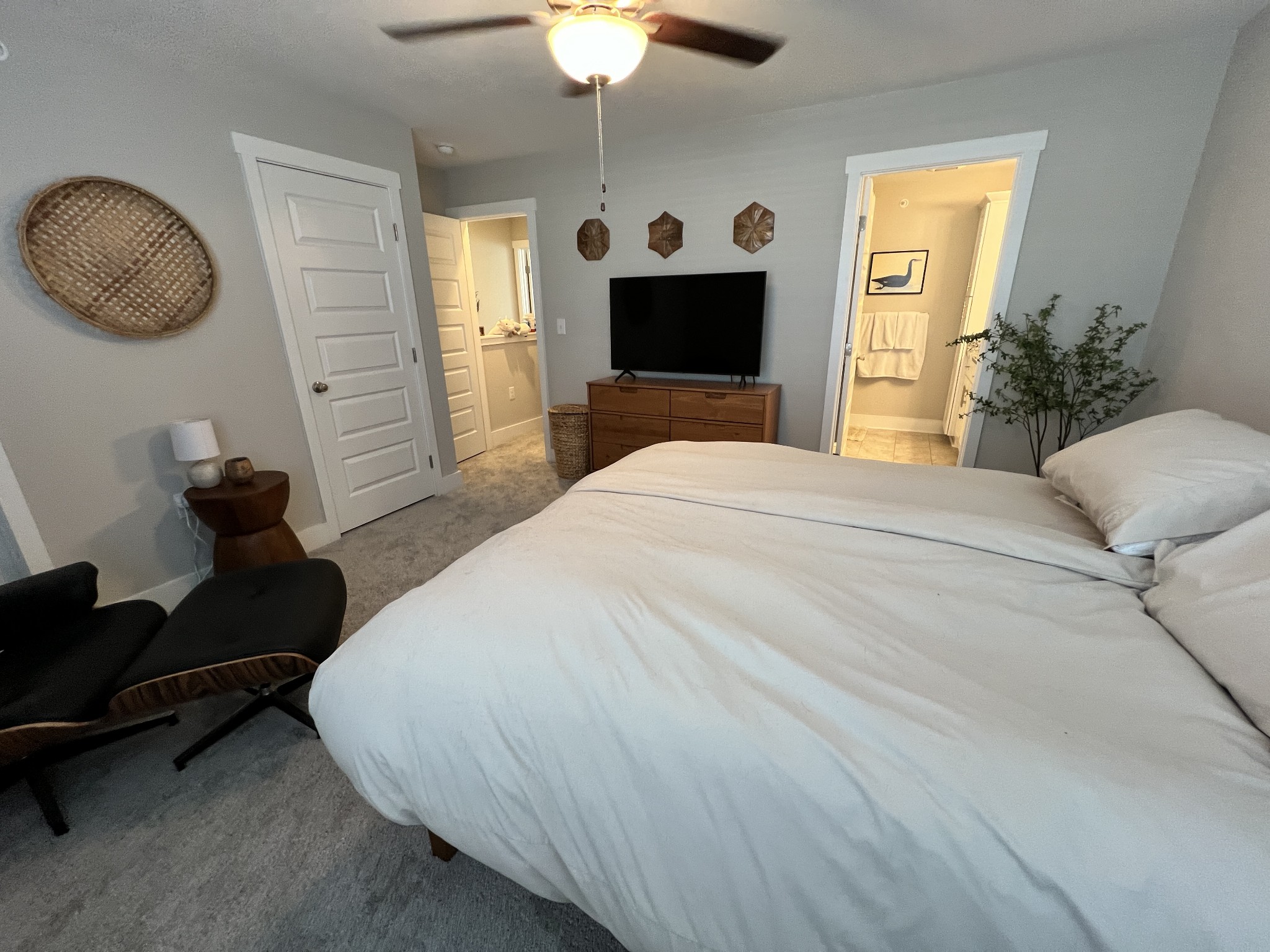 1040 Wells Way Spring Hill, TN 37174 - Photo 13 of 36 a bedroom with a bed and a chandelier