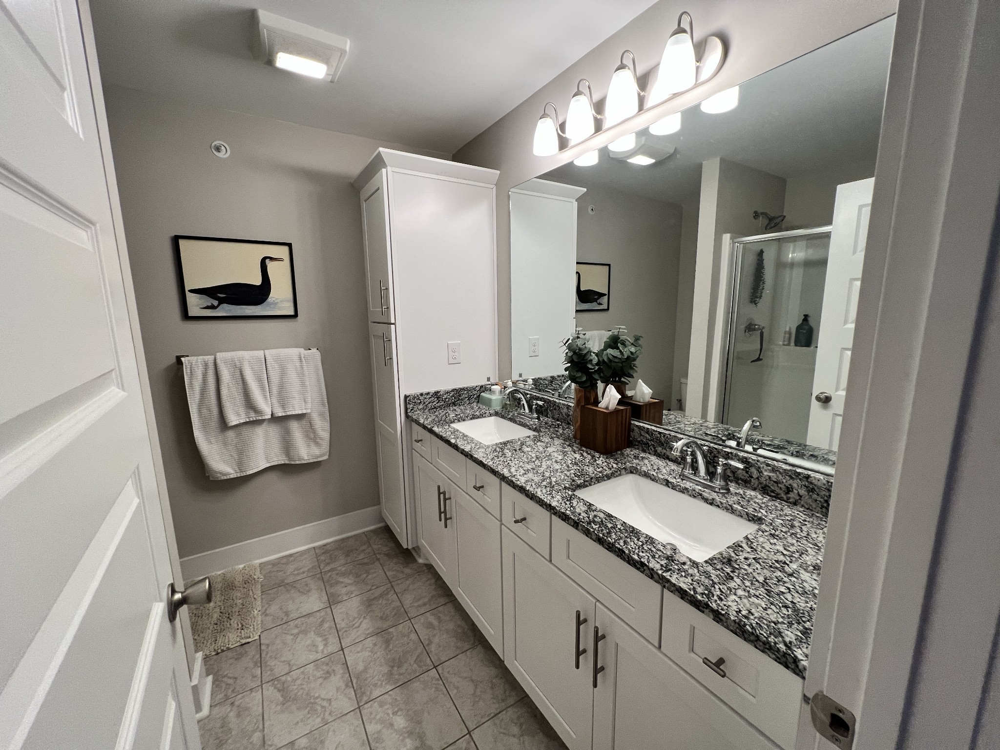 1040 Wells Way Spring Hill, TN 37174 - Photo 16 of 36 a bathroom with a double vanity sink and a mirror