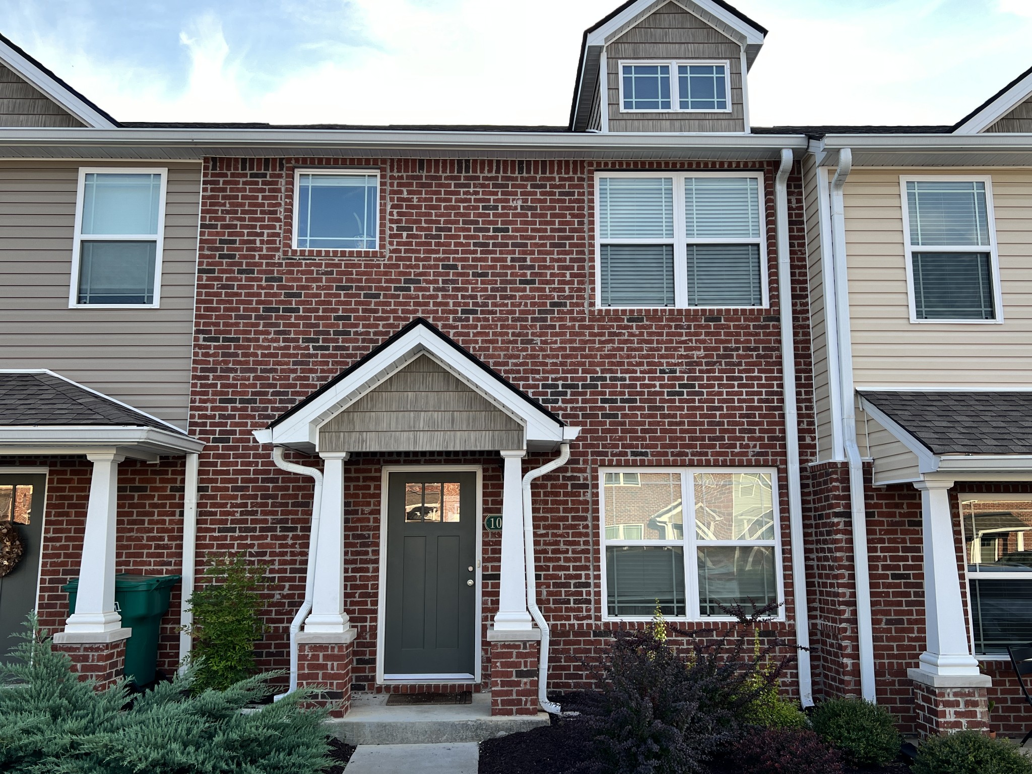 1040 Wells Way Spring Hill, TN 37174 - Photo 2 of 36 a front view of a house with a yard